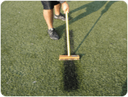 brush remove synthetic turf field paint