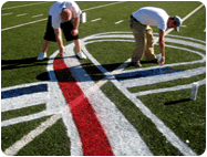 Removable Red Field Paint being applied field stencil